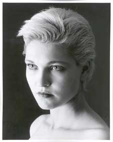 Headshot of a beautiful lady with short blonde hair