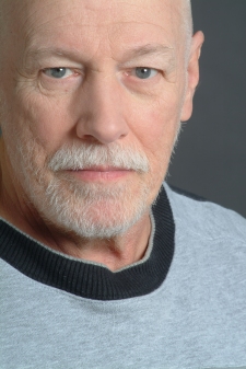 Headshot of a handsome man with a beard