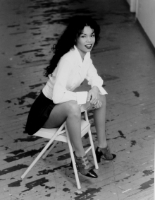 Photograph of a beautiful girl sitting in a chair