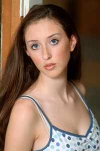 Headshot of a beautiful girl with long brown hair